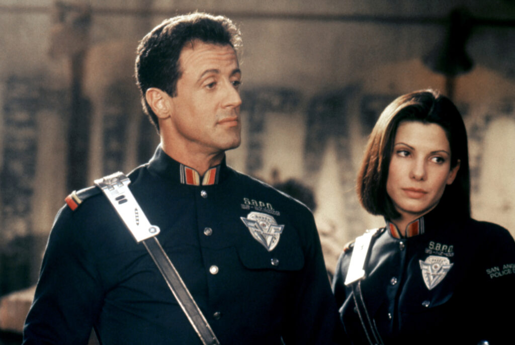 Stallone and Bullock in Demolition Man costume